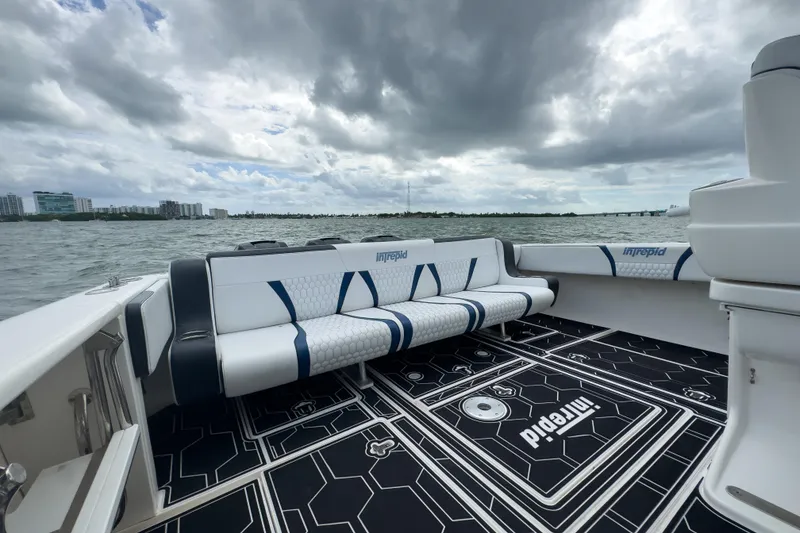 Slide: The Image of 2008 Intrepid 390 Sport Yacht interior with custom seating and scenic ocean view. - 29