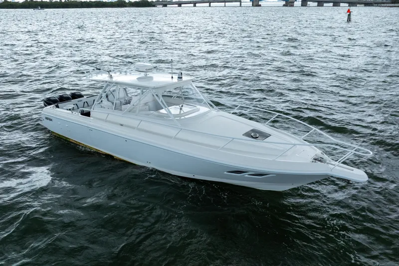 Slide: The Image of 2008 Intrepid 390 Sport Yacht cruising on open water, showcasing sleek design and powerful engines. - 3
