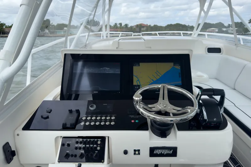 Slide: The Image of Cockpit of 2008 Intrepid 390 Sport Yacht with navigation screens and steering wheel. - 35