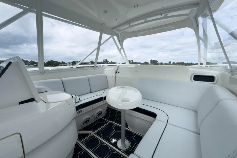 Slide: The Image of Luxurious 2008 Intrepid 390 Sport Yacht interior with white seating and sleek design. - 37