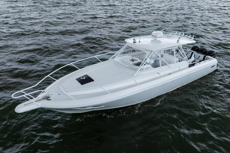 Slide: The Image of 2008 Intrepid 390 Sport Yacht cruising on open water, showcasing sleek design and powerful engines. - 4