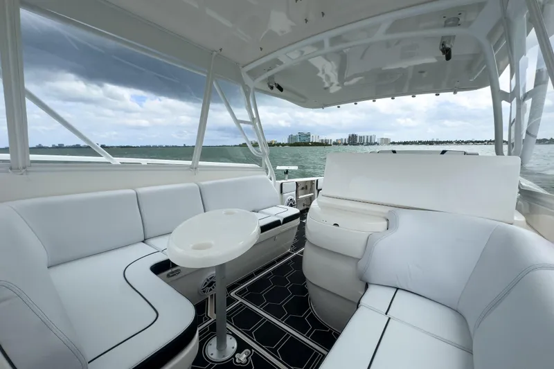 Slide: The Image of Luxurious 2008 Intrepid 390 Sport Yacht interior with white seating and ocean view. - 40