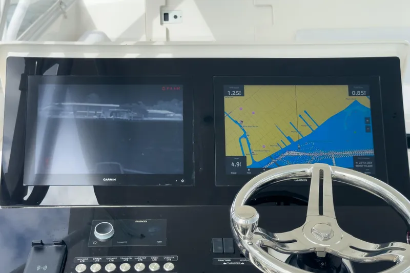 Slide: The Image of Helm of 2008 Intrepid 390 Sport Yacht with navigation screens and steering wheel. - 43