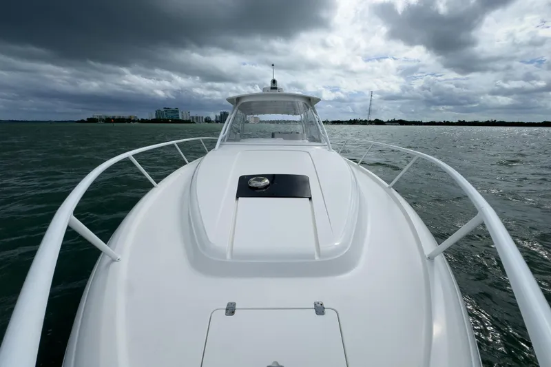 Slide: The Image of 2008 Intrepid 390 Sport Yacht on water under cloudy skies. - 44