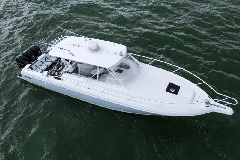 Slide: The Image of 2008 Intrepid 390 Sport Yacht on water, aerial view, sleek design, triple engines. - 8