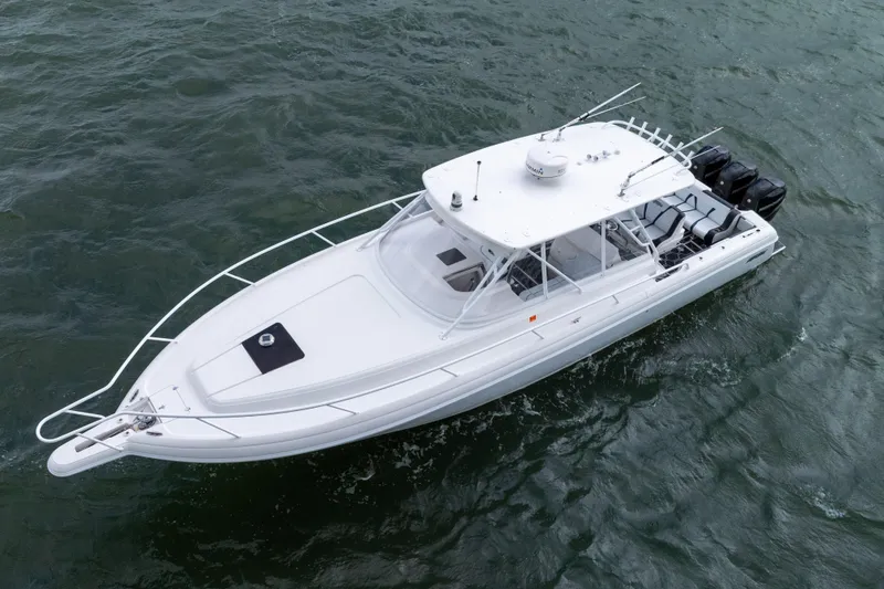 Slide: The Image of 2008 Intrepid 390 Sport Yacht cruising on open water, aerial view. - 9