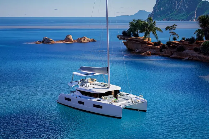 The Image of Lagoon 47 catamaran 2026 in tropical bay. - 0