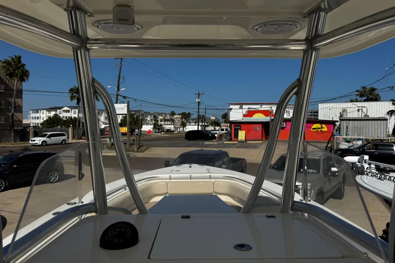 Slide: The Image of 2016 Cobia 296 Center Console boat parked in urban setting, view from helm. - 6