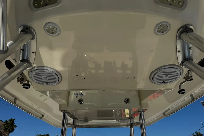Slide: The Image of 2016 Cobia 296 Center Console boat ceiling with speakers and lights. - 9