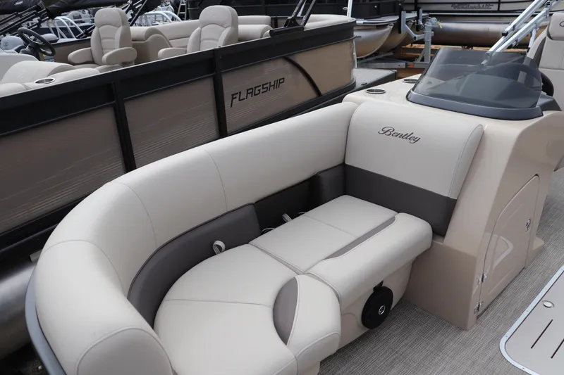 Slide: The Image of 2026 Bentley Pontoons Legacy 223 Fish N Cruise interior with beige seating and helm. - 2