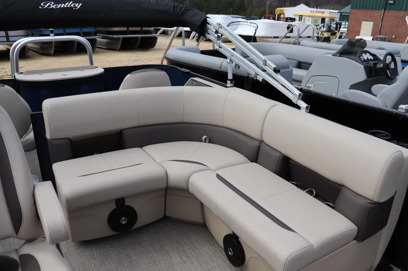 Slide: The Image of 2026 Bentley Pontoons Legacy 223 Fish N Cruise interior with beige seating and modern design. - 6