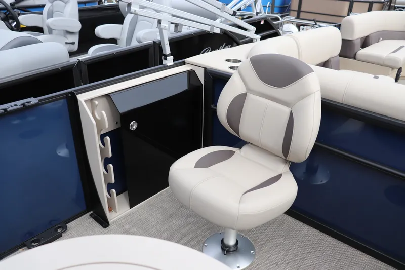 Slide: The Image of 2026 Bentley Pontoons Legacy 223 Fish N Cruise interior with swivel chair and rod holders. - 9