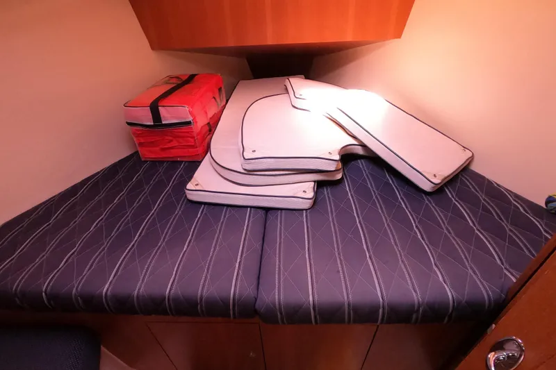Slide: The Image of Interior cabin of 2006 Hunter 33 sailboat with cushions and storage bag. - 22
