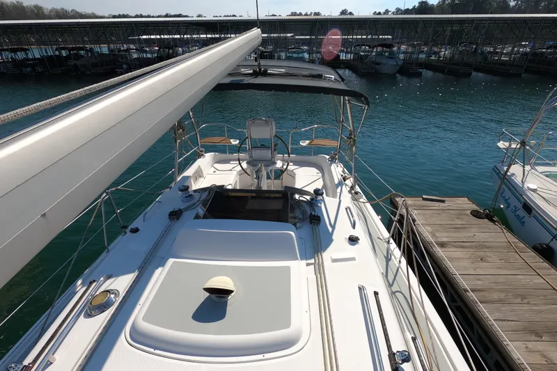 Slide: The Image of Sailboat docked at marina, Hunter 33 model, 2006, with clear blue water background. - 29