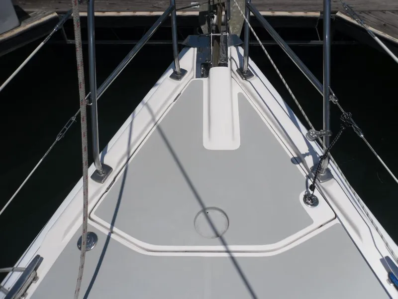 Slide: The Image of Deck of a 2006 Hunter 33 sailboat in harbor. - 32