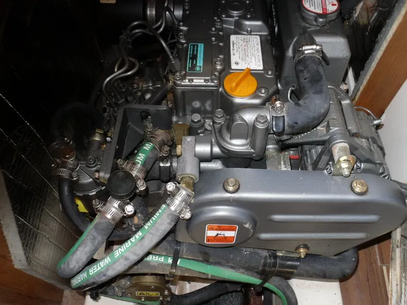 Slide: The Image of Engine of a 2006 Hunter 33 sailboat with hoses and fittings. - 34