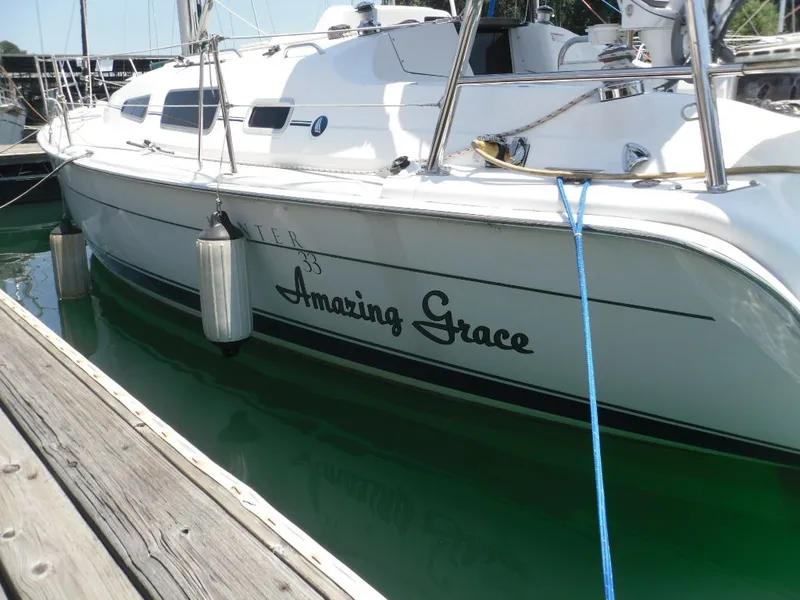 Slide: The Image of 2006 Hunter 33 sailboat named Amazing Grace docked in marina. - 4