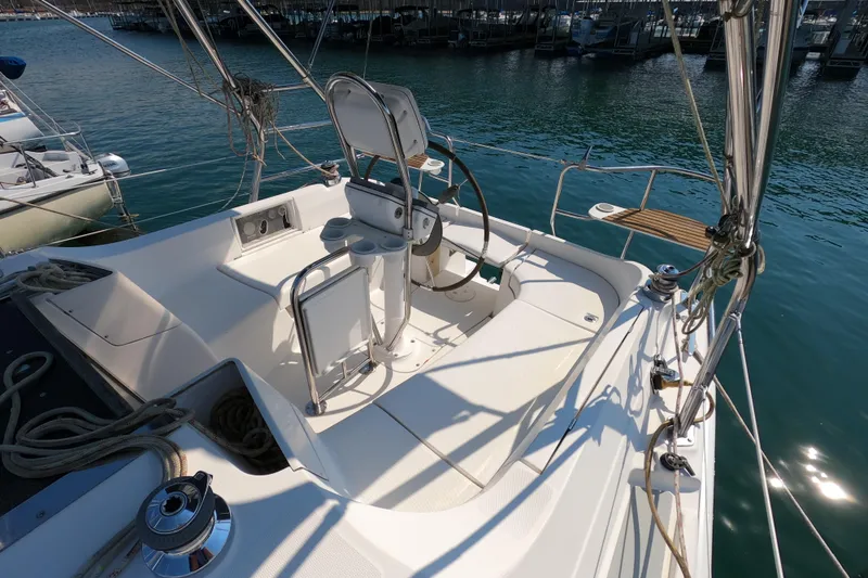 Slide: The Image of Cockpit of a 2006 Hunter 33 sailboat docked at a marina. - 7