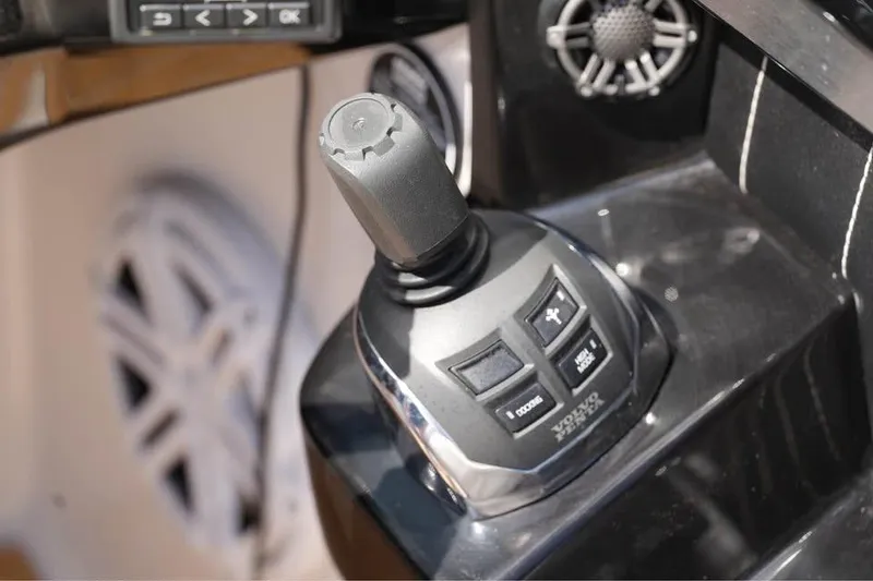 Slide: The Image of Joystick control on 2015 Four Winns H290 boat dashboard. - 14