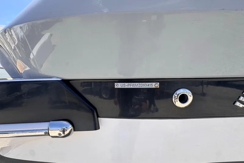Slide: The Image of 2015 Four Winns H290 boat hull identification number plate close-up. - 32