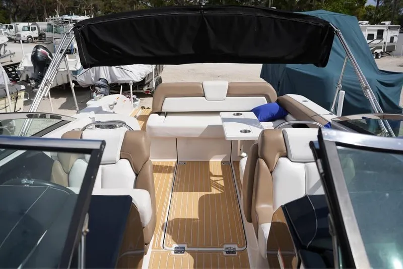 Slide: The Image of 2015 Four Winns H290 boat interior with seating and canopy. - 7