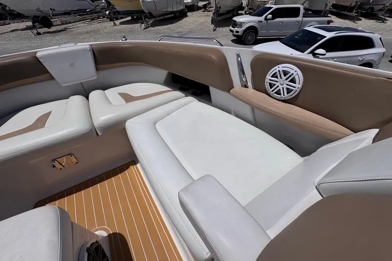 Slide: The Image of Luxurious seating on 2015 Four Winns H290 boat, featuring tan and white upholstery. - 74