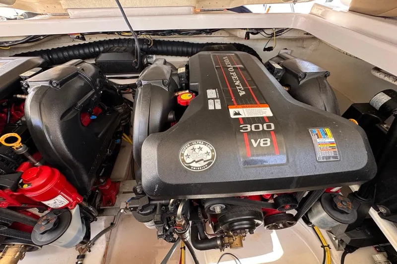 Slide: The Image of Engine compartment of a 2015 Four Winns H290 boat featuring a Volvo Penta 300 V8 engine. - 81
