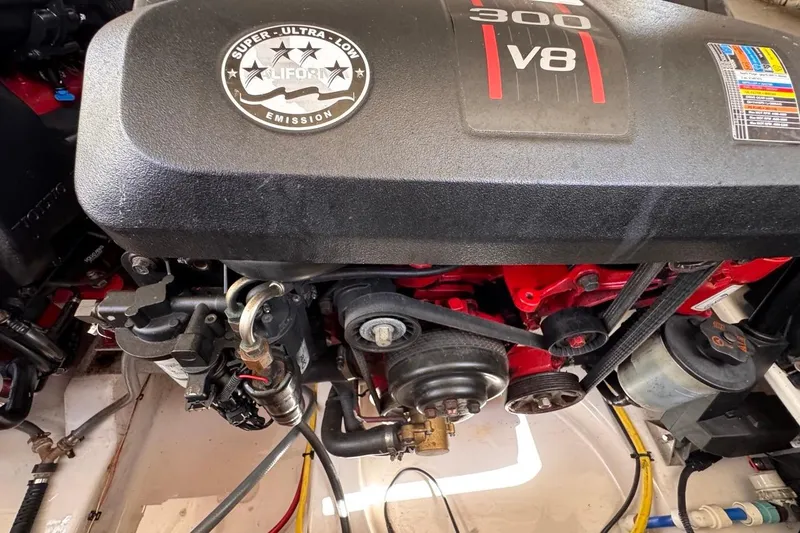 Slide: The Image of Engine of a 2015 Four Winns H290 boat, featuring a 300 V8 motor. - 88