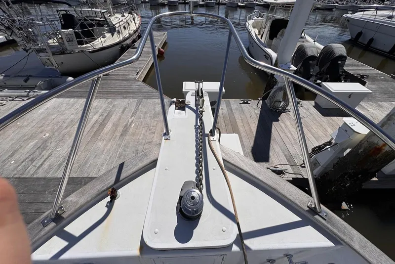 Slide: The Image of Bow view of 1995 Island Gypsy Eurosedan 32 at marina dock. - 10