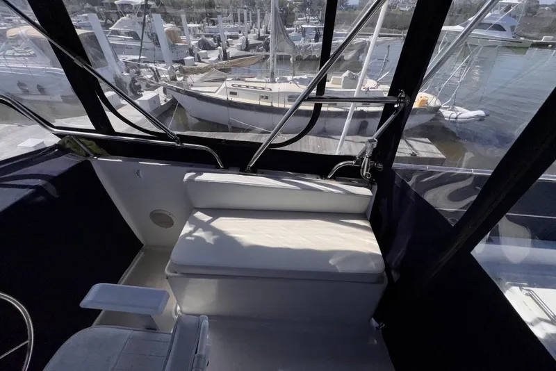 Slide: The Image of Interior view of 1995 Island Gypsy Eurosedan 32 boat with marina background. - 22