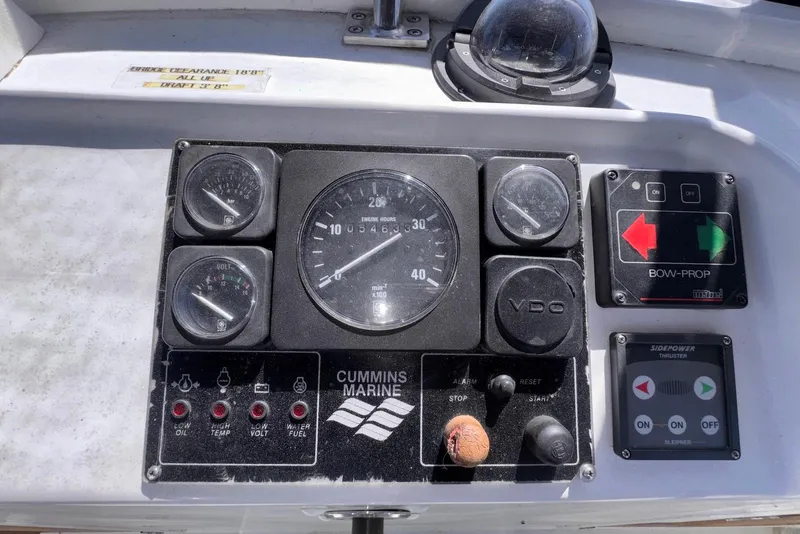 Slide: The Image of Control panel of a 1995 Island Gypsy Eurosedan 32 boat with Cummins Marine gauges. - 26