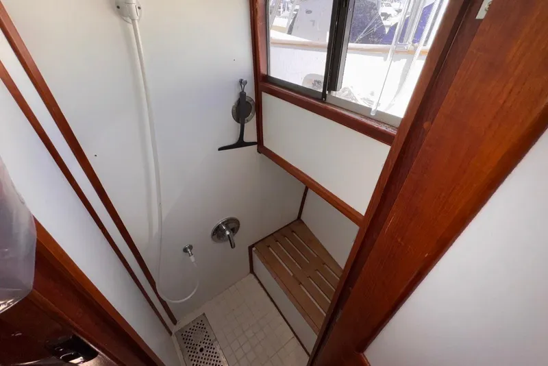 Slide: The Image of Shower area in 1995 Island Gypsy Eurosedan 32 boat with wooden accents. - 46