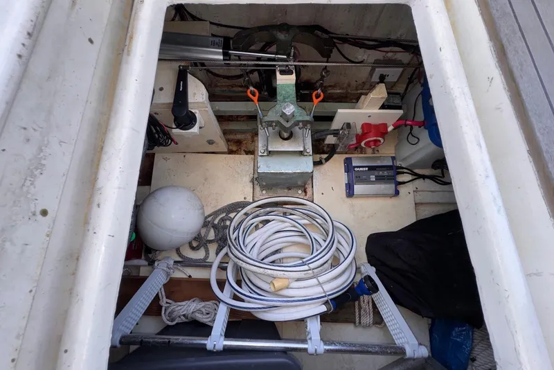 Slide: The Image of Interior view of 1995 Island Gypsy Eurosedan 32 boat compartment with equipment and cables. - 50