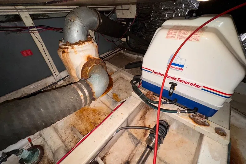 Slide: The Image of Engine room of 1995 Island Gypsy Eurosedan 32 with Fischer Panda generator and exhaust system. - 51