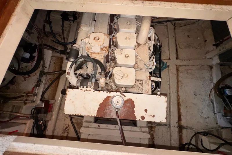 Slide: The Image of Engine compartment of a 1995 Island Gypsy Eurosedan 32, showing machinery and wiring. - 55