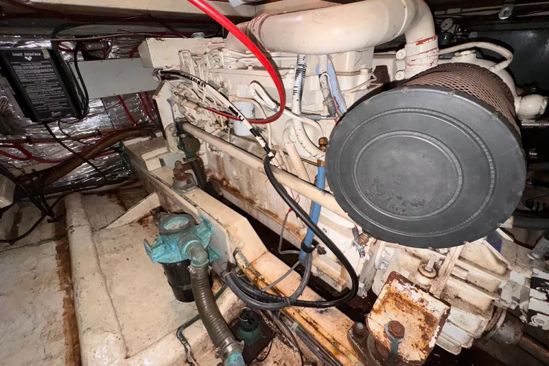 Slide: The Image of Engine compartment of a 1995 Island Gypsy Eurosedan 32, showing mechanical components and wiring. - 59