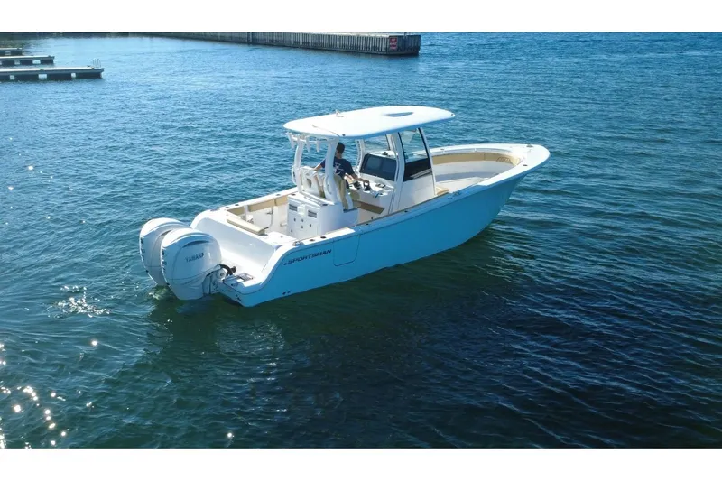 The Image of 2025 Sportsman Open 282 Center Console boat on water, featuring twin Yamaha engines. - 1