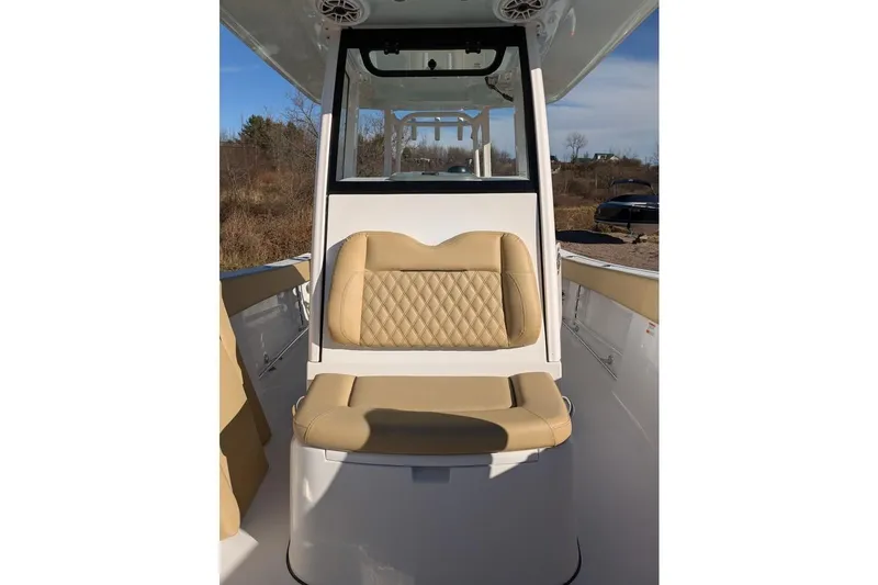 Slide: The Image of 2025 Sportsman Open 282 Center Console boat with tan cushioned seating. - 12