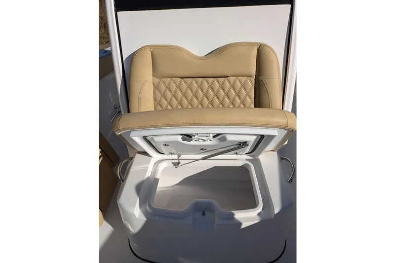 Slide: The Image of 2025 Sportsman Open 282 Center Console seat with storage compartment open. - 13