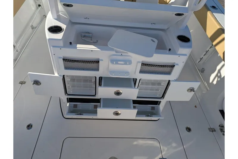 Slide: The Image of 2025 Sportsman Open 282 Center Console boat interior with storage compartments open. - 21