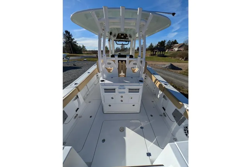 Slide: The Image of 2025 Sportsman Open 282 Center Console boat interior with helm and seating. - 22