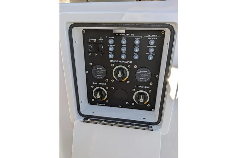 Slide: The Image of Control panel of 2025 Sportsman Open 282 Center Console boat, featuring circuit protection switches. - 4