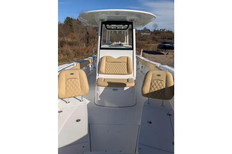 Slide: The Image of 2025 Sportsman Open 282 Center Console boat with tan seating and sleek design. - 5