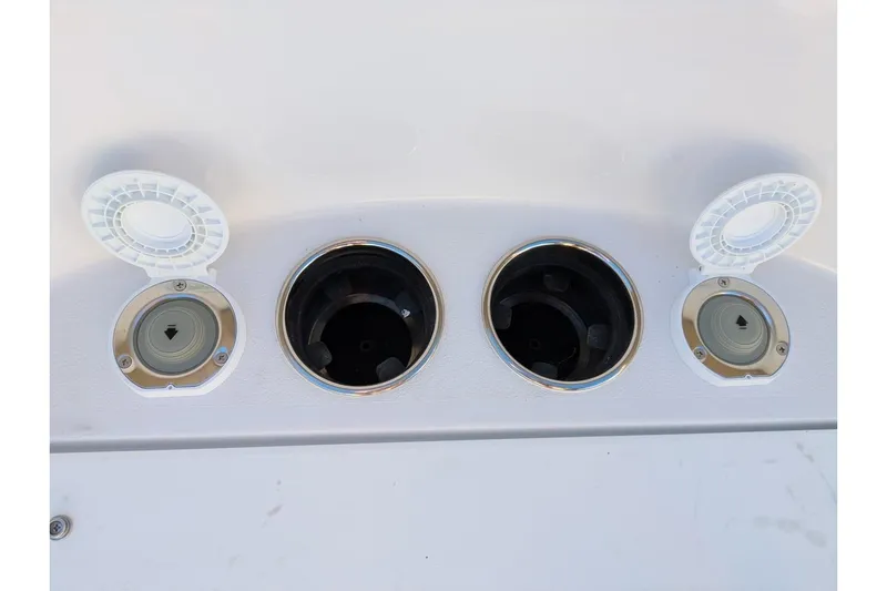 Slide: The Image of 2025 Sportsman Open 282 Center Console boat cup holders and storage compartments. - 7