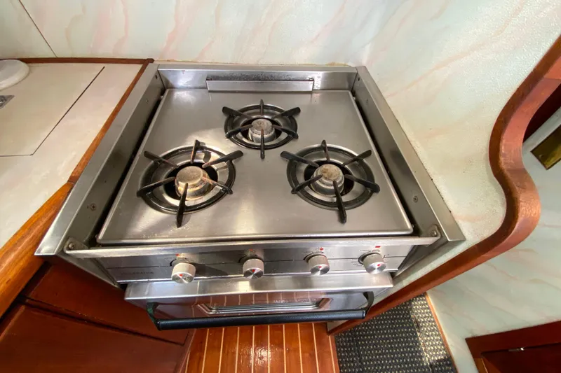 Slide: The Image of Stainless steel stove with three burners on 1989 Bayliner 3288 Motoryacht. - 10
