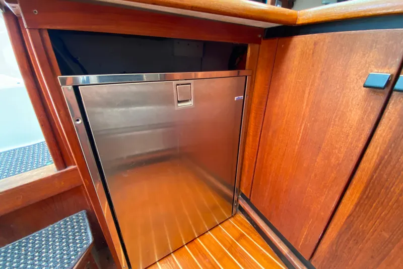 Slide: The Image of Stainless steel refrigerator in 1989 Bayliner 3288 Motoryacht's wooden interior. - 11