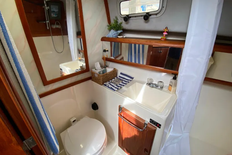 Slide: The Image of Bathroom interior of 1989 Bayliner 3288 Motoryacht with sink, toilet, and shower. - 17