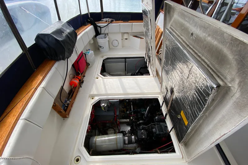 Slide: The Image of 1989 Bayliner 3288 Motoryacht engine compartment with open hatches and visible machinery. - 33
