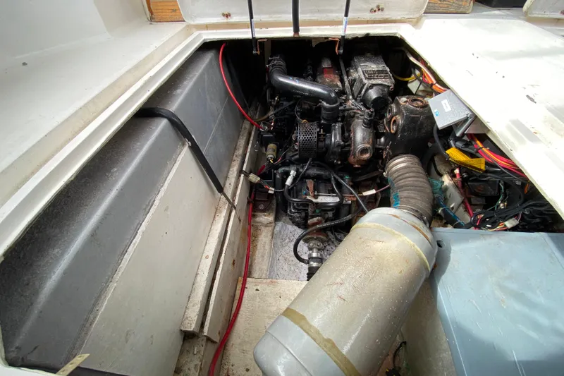 Slide: The Image of Engine compartment of a 1989 Bayliner 3288 Motoryacht, showcasing mechanical components and wiring. - 36