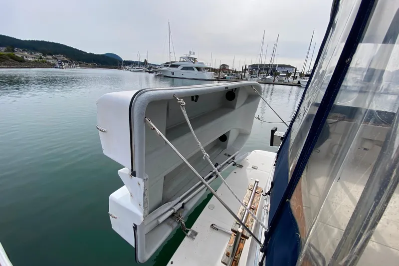 Slide: The Image of 1989 Bayliner 3288 Motoryacht docked in a marina, featuring a raised swim platform. - 41